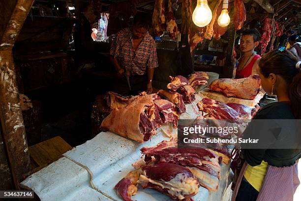 Man sells beef at Iewduh Bazar in Shillong, Meghalaya. Lewduh, also known as Bara Bazar, is a bustling marketplace in Shillong that earns immense...