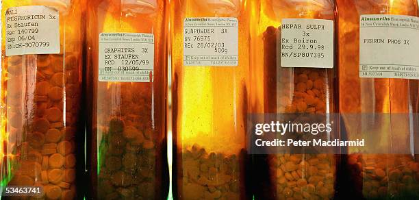 Bottles of homeopathic remedies are displayed at Ainsworths Pharmacy on August 26, 2005 in London. British medical journal The Lancet has attacked...