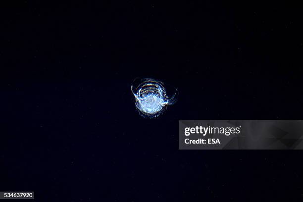 This handout image supplied by the European Space Agency , shows a chip in the window of one of the quadruple glazed windows of the Cupola after the...