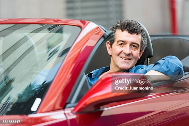 mature man driving his convertible car - midlife crisis stock pictures, royalty-free photos & images