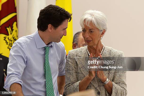 Canadian Prime Minister Justin Trudeau talks with International Monetary Fund Managing Director Christine Lagarde during a "Outreach Session" on May...