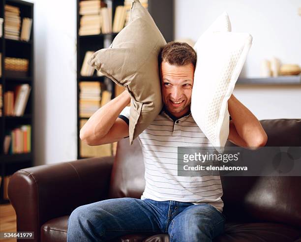 young man in home interior - rude awakening stock pictures, royalty-free photos & images