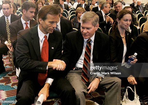 Senator John Thune shakes hands with U.S. Senator Tim Johnson after the Base Closure and Realignment Commission voted to save Ellsworth Air Force...