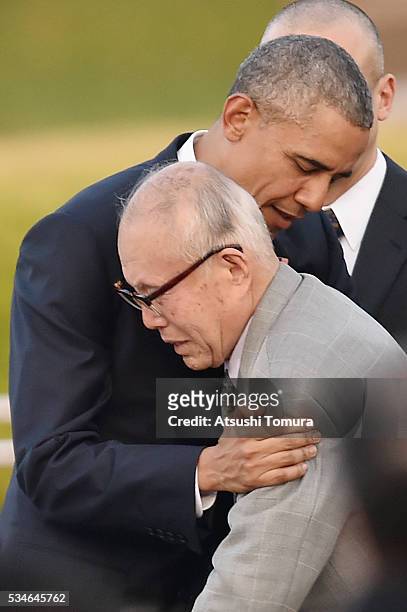 President Barack Obama embraces atomic bomb survivor Shigeaki Mori during his visit to the Hiroshima Peace Memorial Park on May 27, 2016 in...