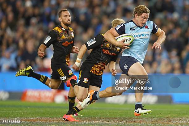 Michael Hooper of the Waratahs breaks away to score a try during the round 14 Super Rugby match between the Waratahs and the Chiefs at Allianz...