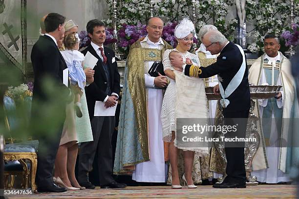 Crown Princess Victoria of Sweden,Prince Oscar of Sweden and King Carl Gustaf of Sweden are seen at The Royal Palace for the Christening of Prince...