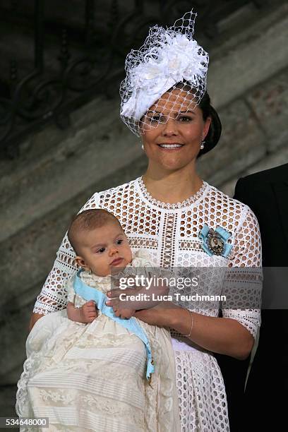 Crown Princess Victoria of Sweden and Prince Oscar of Sweden are seen at The Royal Palace for the Christening of Prince Oscar of Sweden on May 27,...