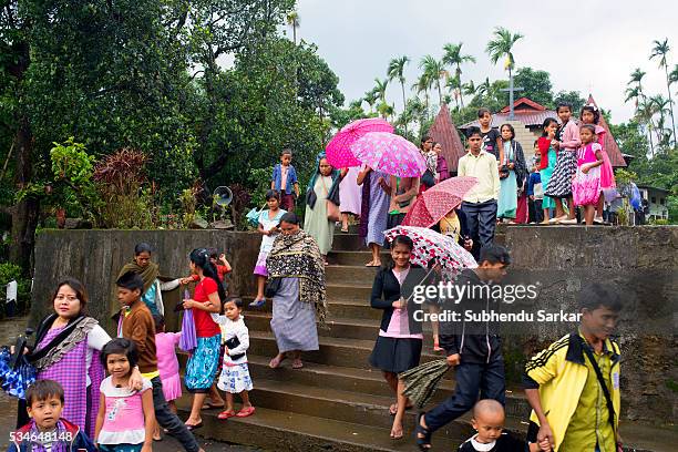 Khasi villagers come out after offering prayers in a church in Meghalaya. Meghalaya is a state in north-east India which means "the abode of clouds"...