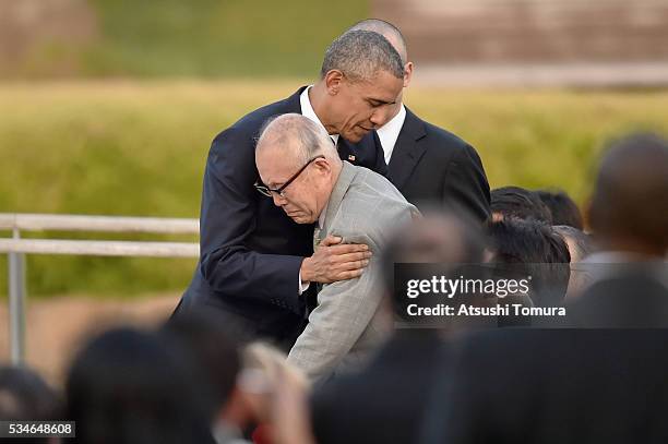 President Barack Obama embraces atomic bomb survivor Shigeaki Mori during his visit to the Hiroshima Peace Memorial Park on May 27, 2016 in...