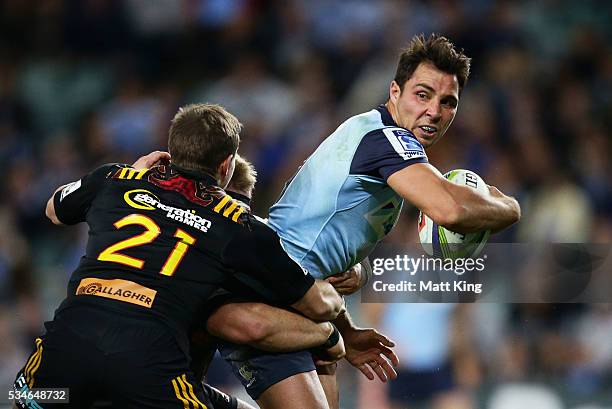 Nick Phipps of the Waratahs sets up a try to Israel Folau with an offload during the round 14 Super Rugby match between the Waratahs and the Chiefs...