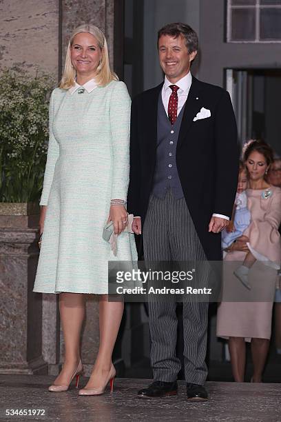 Crown Princess Mette-Marit of Norway and Crown Prince Frederik of Denmark are seen after the christening of Prince Oscar of Sweden at Royal Palace of...