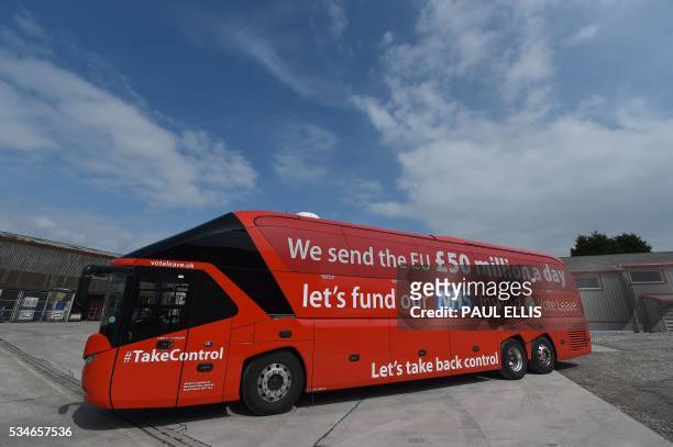 Slogan reading "lets fund our NHS instead. Vote Leave" is pictured on the side of the "Vote Leave" battle-bus, the official 'Leave' campaign...