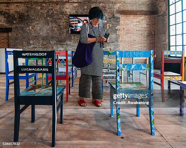Woman attends at the South Africa Pavillion of the 15th Architecture Venice Biennale, on May 27, 2016 in Venice, Italy. The 15th International...