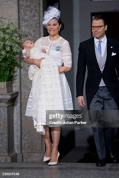 Crown Princess Victoria of Sweden, with Prince Oscar of Sweden, and Prince Daniel of Sweden, at the christening of Prince Oscar of Sweden at the...