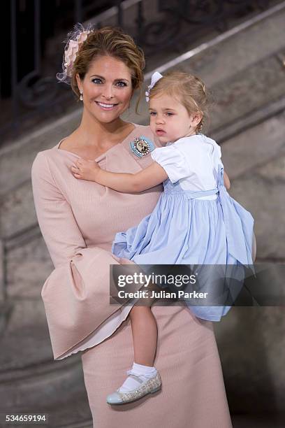 Princess Madeleine of Sweden and Princess Leonore of Sweden attend the christening of Prince Oscar of Sweden at the Royal Palace of Stockholm on May...