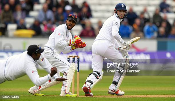 England batsman Alex Hales is caught at slip by Angelo Matthews as wickekeeper Dinesh Chandimal looks on during day one of the 2nd Investec Test...