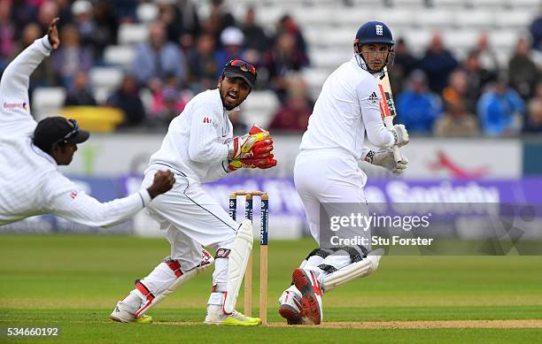 England batsman Alex Hales is caught at slip by Angelo Matthews as wickekeeper Dinesh Chandimal looks on during day one of the 2nd Investec Test...