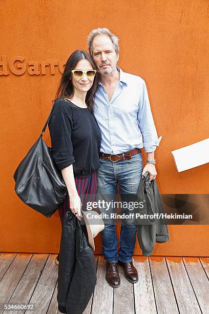 Christopher Thompson and Geraldine Pailhas attend the French Tennis Open Day 6 at Roland Garros on May 27, 2016 in Paris, France.