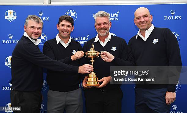 Europe Ryder Cup Captain Darren Clarke of Northern Ireland poses with the Ryder Cup and his vice-captains Paul Lawrie of Scotland, Padraig Harrington...