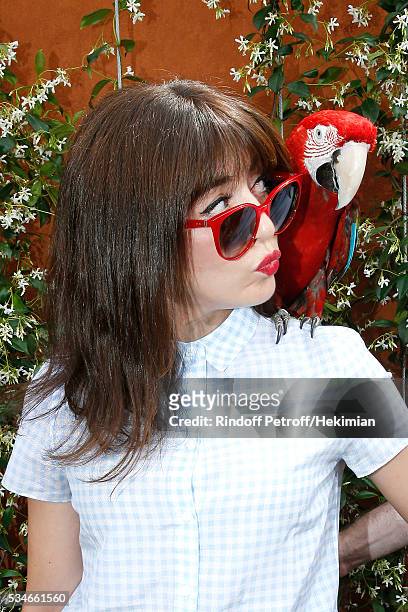 Singer Nolwenn Leroy and parrot Arthur attend the 2016 French Tennis Open - Day Six at Roland Garros on May 27, 2016 in Paris, France.
