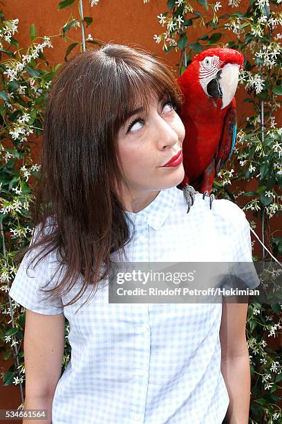 Singer Nolwenn Leroy and parrot Arthur attend the 2016 French Tennis Open - Day Six at Roland Garros on May 27, 2016 in Paris, France.