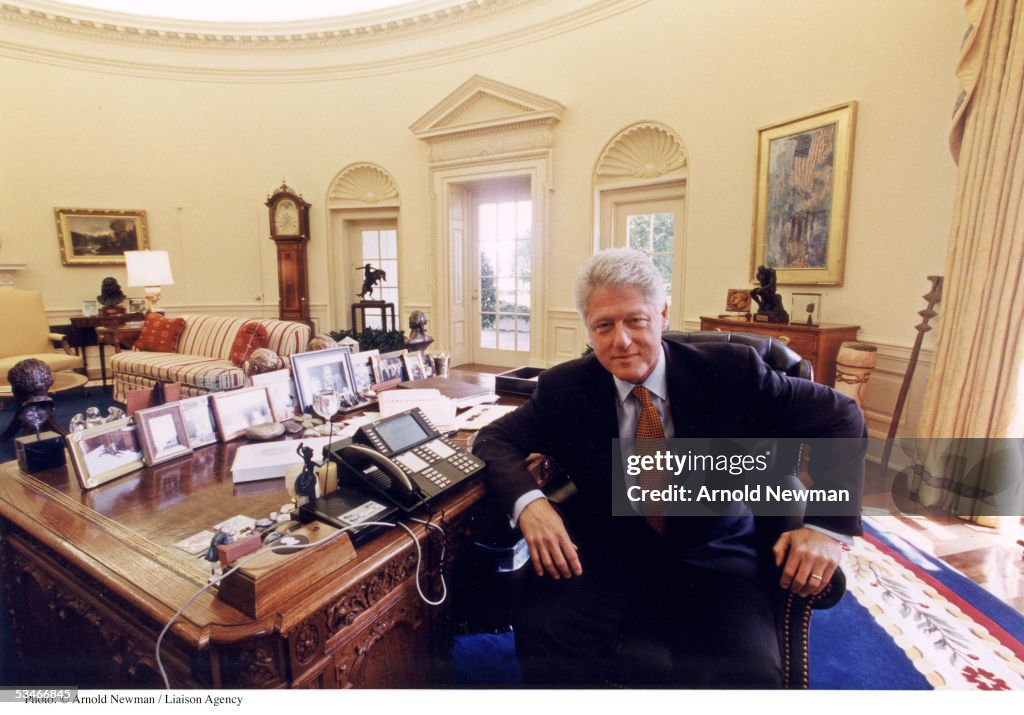 US President Bill Clinton poses for portrait in the Oval Office... News ...