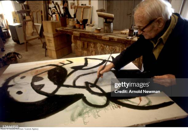 Spanish Surrealist artist Joan Miro paints in his studio March 22, 1979 in Mallorca, Spain.