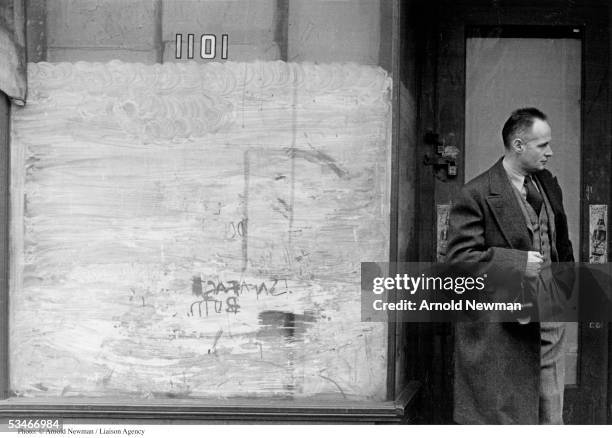 French photographer Henri Cartier-Bresson stands in doorway of tenement building January 7, 1947 in New York City.