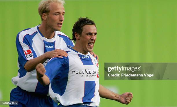Marcel Schied celebrates scoring the first goal with Tim Sebastian of Rostock during the Second Bundesliga match between Hansa Rostock and Eintracht...
