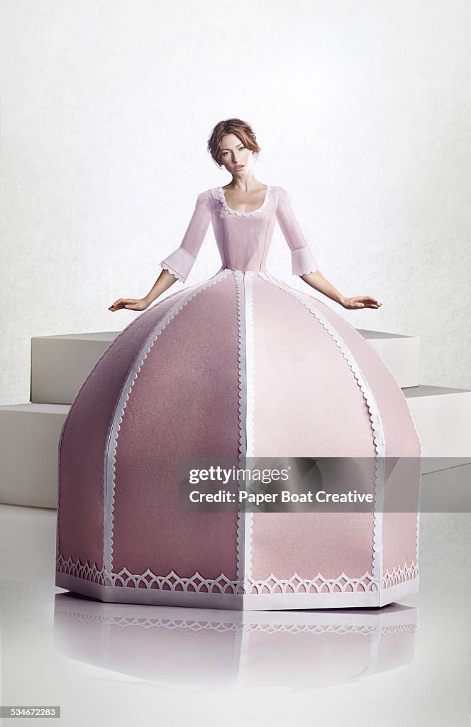 Beautiful lady in large pink paper craft dress