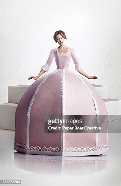 beautiful lady in large pink paper craft dress - princess dress imagens e fotografias de stock