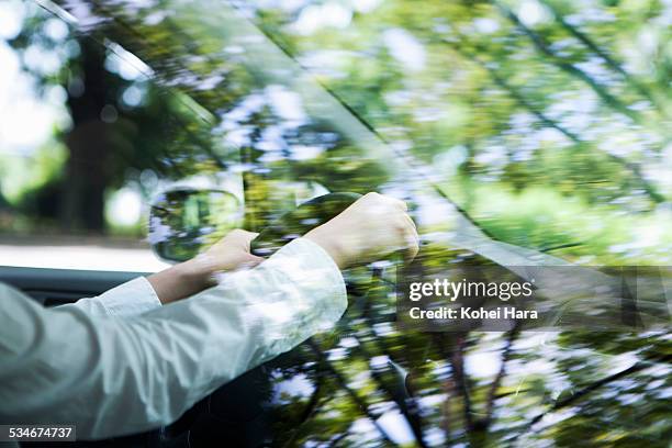 woman driving a car - vehículo terrestre fotografías e imágenes de stock