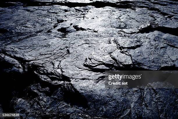 surface of rock - vulkanisch gesteente stockfoto's en -beelden