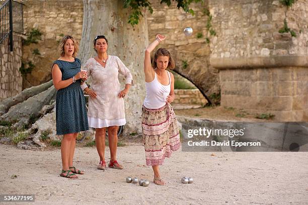 women playing petanque in provence, france - boules stock-fotos und bilder