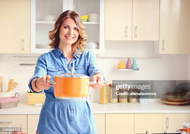 beautiful blonde woman in the modern kitchen - pan-head stock pictures, royalty-free photos & images