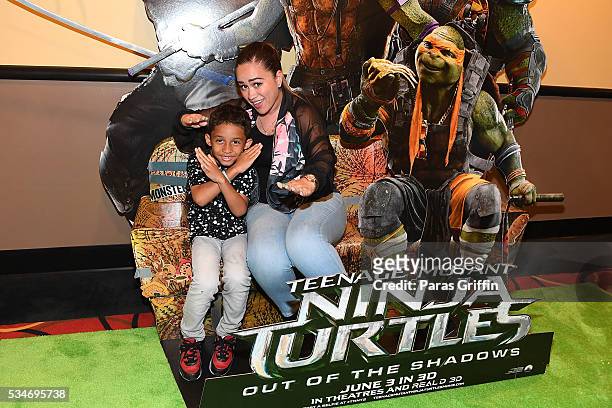 Sarah Vivan and her son Dwayne Michael Carter III attend "Teenage Mutant Ninja Turtles: Out Of The Shadows" Atlanta screening at AMC Phipps Plaza on...
