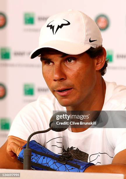 Rafael Nadal of Spain announces during a press conference that he is withdrawing from the tournament due to a wrist injury on day six of the 2016...