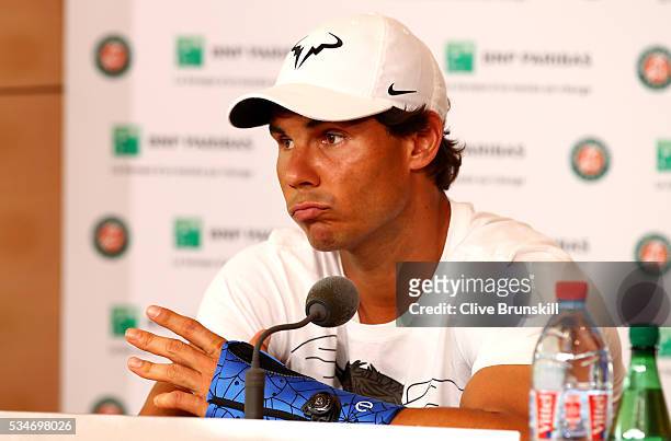 Rafael Nadal of Spain announces during a press conference that he is withdrawing from the tournament due to a wrist injury on day six of the 2016...