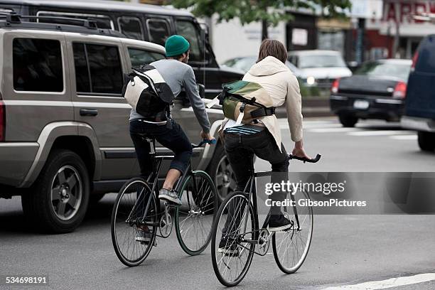 bike messengers in nyc - side by side car stock pictures, royalty-free photos & images