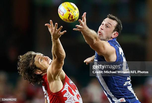 Todd Goldstein of the Kangaroos and Kurt Tippett of the Swans compete in a ruck contest during the 2016 AFL Round 10 match between the Sydney Swans...