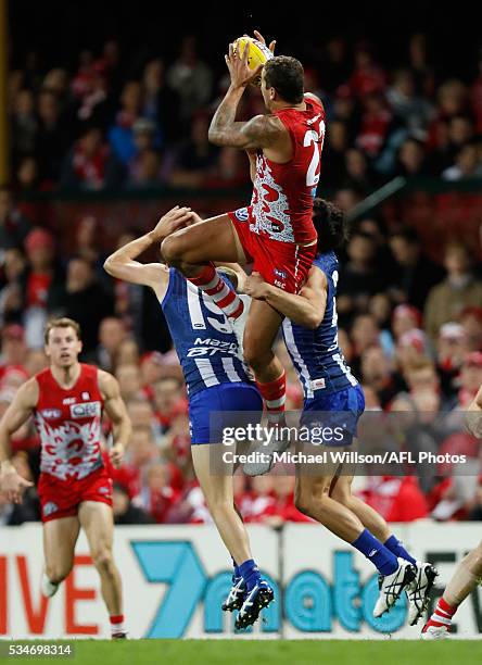 Lance Franklin of the Swans attempts a spectacular mark over Sam Wright and Robbie Tarrant of the Kangaroos during the 2016 AFL Round 10 match...