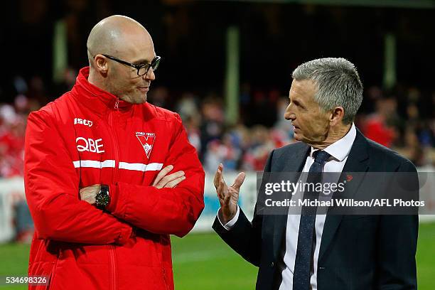 Tom Harley and Bruce McAvaney share a discussion during the 2016 AFL Round 10 match between the Sydney Swans and the North Melbourne Kangaroos at the...