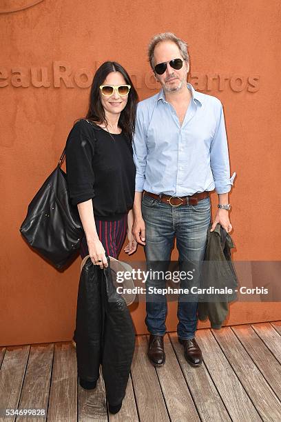 Actress Geraldine Pailhas and her husband Christopher Thompson attend day six of the 2016 French Open at Roland Garros on May 27, 2016 in Paris,...