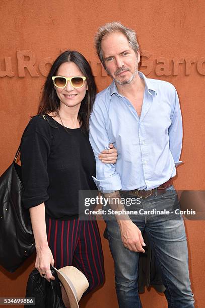 Actress Geraldine Pailhas and her husband Christopher Thompson attend day six of the 2016 French Open at Roland Garros on May 27, 2016 in Paris,...