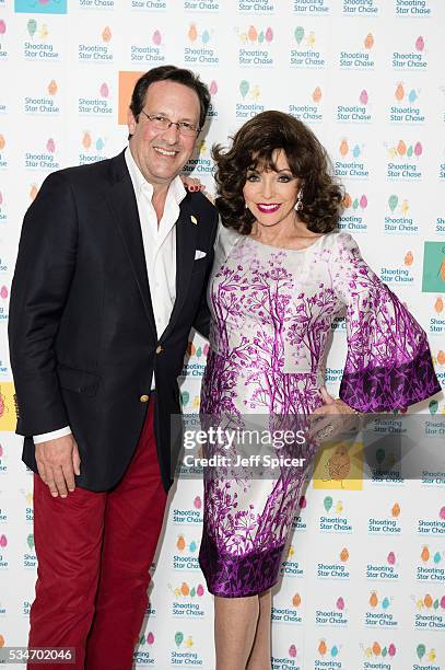 Percy Gibson and Joan Collins arrive for Star Chase Children's Hospice Event at The Dorchester on May 27, 2016 in London, England.