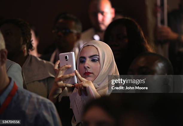 Family member of a new American citizen photographs a naturalization ceremony held on Ellis Island on May 27, 2016 in New York City. U.S. Secretary...