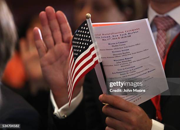 Group of immigrants become new American citizens during a naturalization ceremony on Ellis Island on May 27, 2016 in New York City. U.S. Secretary of...