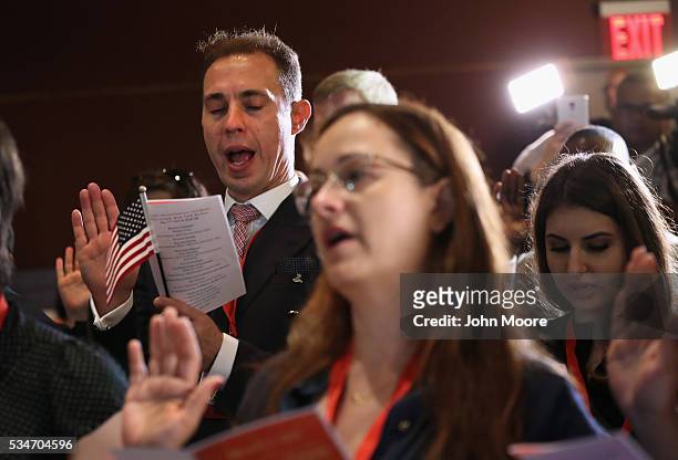 Group of immigrants become new American citizens during a naturalization ceremony on Ellis Island on May 27, 2016 in New York City. U.S. Secretary of...