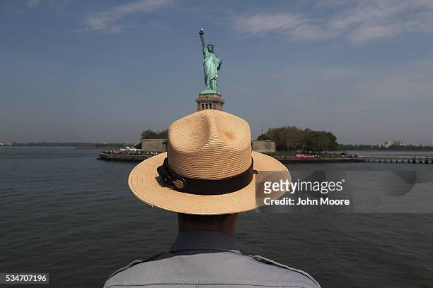 Park ranger looks towards the Statue of Liberty while in route to Ellis Island on May 27, 2016 in New York City. U.S. Secretary of Homeland Security...
