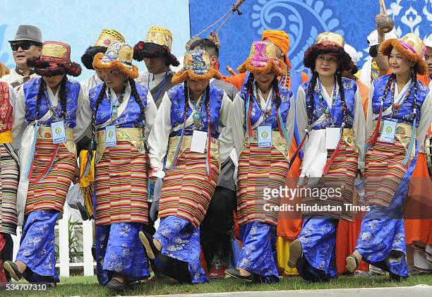 Artists dressed in their traditional attire during the oath taking ceremony of Mamata Banerjee as Chief Minister of West Bengal at Red Road on May...